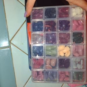 Set of press on nails, various colors/sizes in plastic case